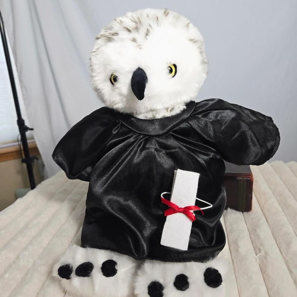 Hedwig snowy owl plush with yellow eyes and detailed feather markings.